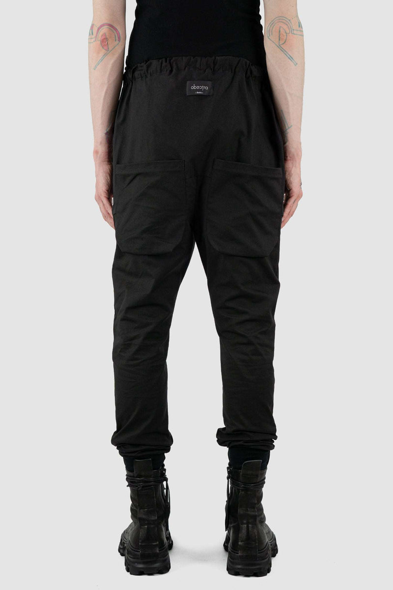 Back view of Black Dawn Jogger Pants for Men with relaxed fit and low crotch, OBECTRA