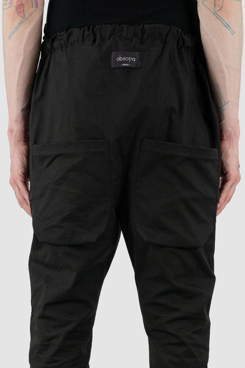 Detail view of Black Dawn Jogger Pants for Men with relaxed fit and low crotch, OBECTRA