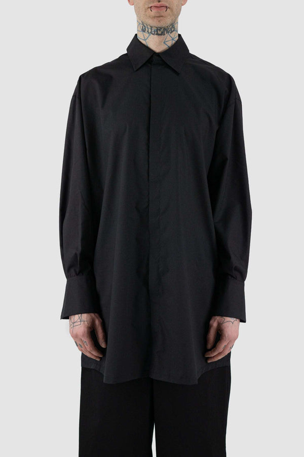 UY STUDIO Black Long Cotton Blend Shirt: SS24 Collection, pointed collar, loose fit, black color. Composition: 65%PL, 35% Cotton. Features 10cm double-layered cuffs with 2 press buttons, 7cm center-back pleat, 18cm side slit opening. Invisible black metallic press buttons. Visible vegan leather UY label on the back