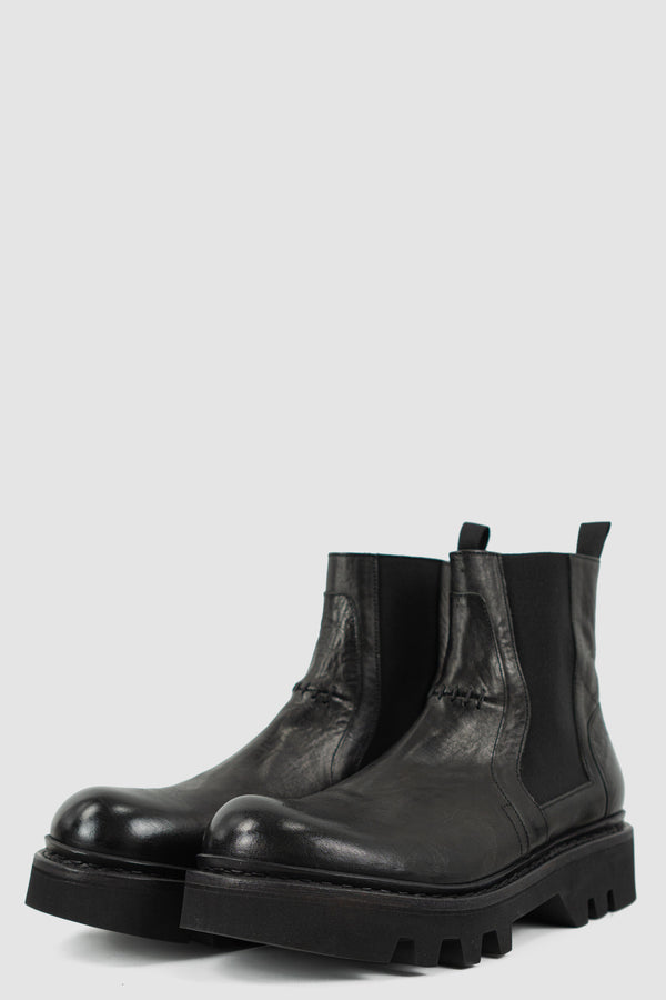 THE LAST CONSPIRACY Black Leather Chelsea Boots: SS24 Collection, Ankle High, Scar Stitch Detail, Tractor Sole, Back Pull, Made in Portugal from 100% Horse Leather.