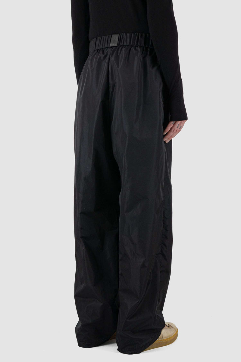 Back side View of Wide Nylon Fisher Pants with Vegan Leather Label by UY Studio