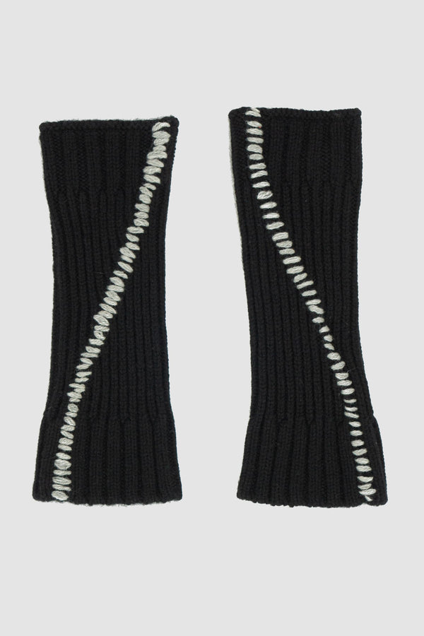 First Aid to the Injured - solo front view of black knitted contrast stitch wool mittens from the FW24 collection with large gray contrast scar stitching on the top and separate thumb hole.