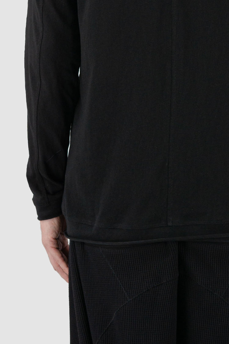 First Aid to the Injured - cuff detail view of black cotton raglan long sleeve T-Shirt for men from the FW24 collection with decorative shoulder sections, heavy back and arm seams.