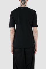 First Aid to the Injured - back view of black cotton T-Shirt with asymmetrical stitching for men from the FW24 collection with decorative flatlock seams on the body and shoulders.