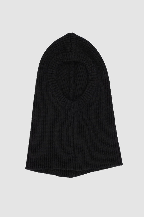 First Aid to the Injured - solo front view of black knitted wool blend balaclava hood from the FW24 collection with extra length, which can also be worn as a loop scarf and neck warmer.