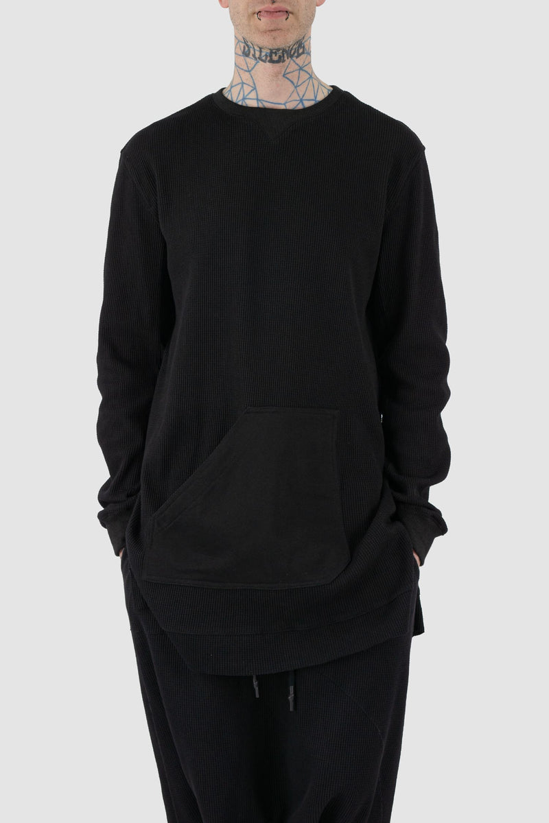 First Aid to the Injured - front relax view of black long waffle textured cotton jersey sweater for men from the FW24 collection. Featured a kangaroo pocket, contrasting arm panels and side slits.