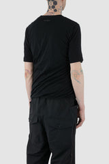 First Aid to the Injured - back side view of black twisted double layer jersey T-Shirt for men from the FW24 collection featuring a distinctive twisting bottom and sleeves crafted in a double layer of thin jersey and a center back seam.