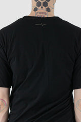 First Aid to the Injured - logo view of black twisted double layer jersey T-Shirt for men from the FW24 collection featuring a distinctive twisting bottom and sleeves crafted in a double layer of thin jersey and a center back seam.