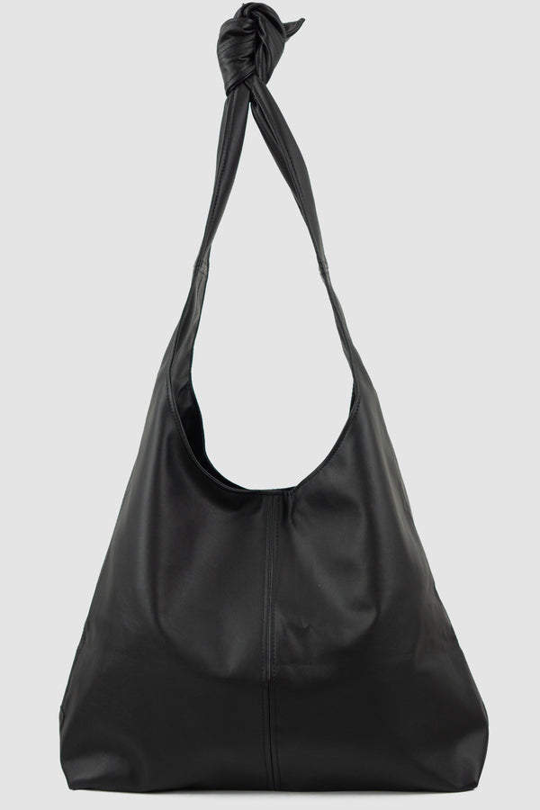 UY STUDIO Black Vegan Leather Bag: Permanent Collection, tie-around straps design, press button closure, black color. Composition: 40% PL, 30% Viscose, 30% Cotton. Features different variations with tie-around straps. Fully lined with woven cotton. Visible vegan leather UY label on the back.