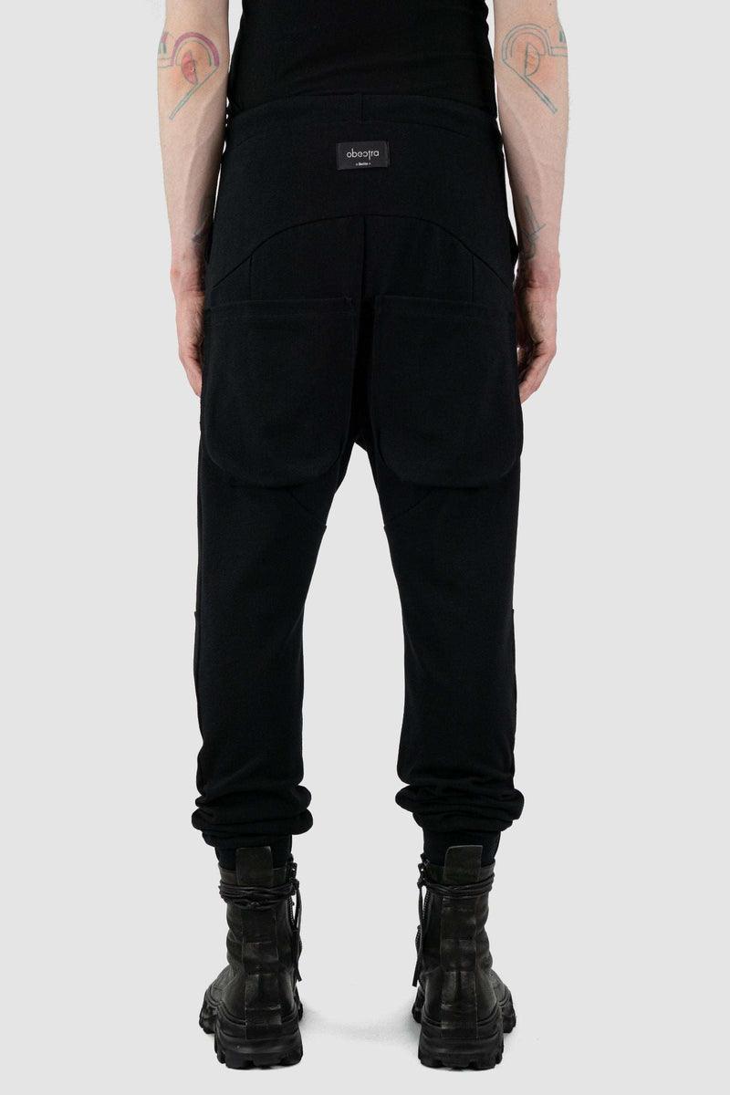 Back view of Black Luna Sweatpants for Men with relaxed fit and low crotch, OBECTRA