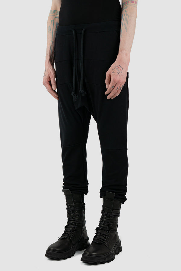 Side view of Black Luna Sweatpants for Men with relaxed fit and low crotch, OBECTRA