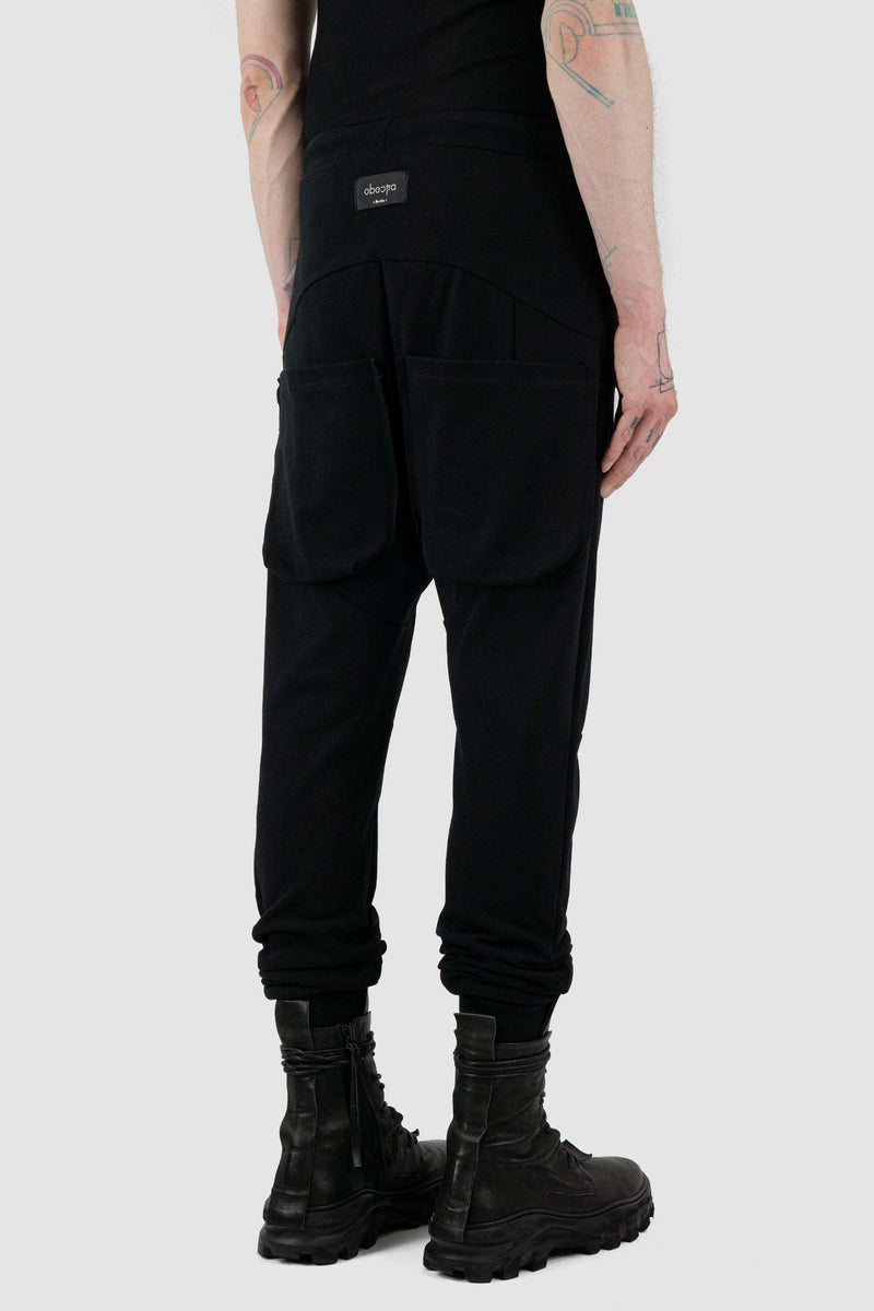 Back side view of Black Luna Sweatpants for Men with relaxed fit and low crotch, OBECTRA