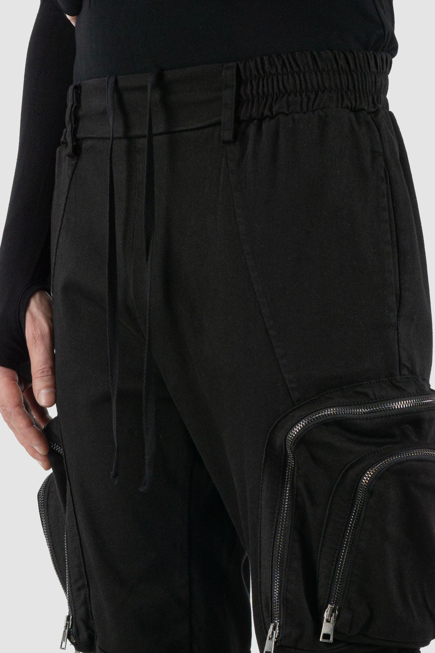 La Haine Inside Us - waist detail view of black cargo trousers with zipper for men from the FW24 collection made of warm dyed cotton.