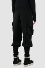 La Haine Inside Us - back side view of black men's heavy cotton baggy cargo sweatpants with high hem at the ankle, adjustable waistband, FW24 collection.