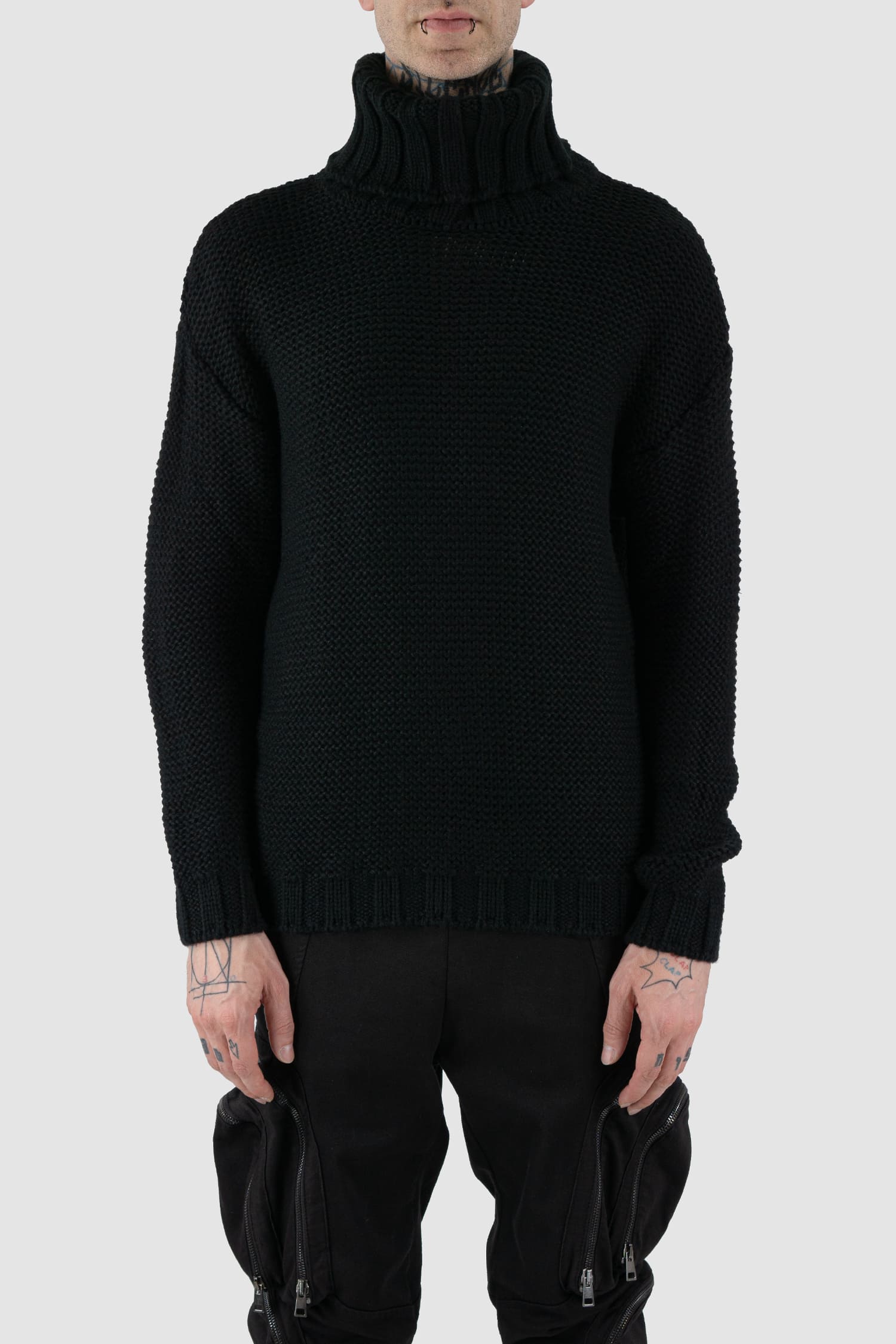 La Haine Inside Us - front view of black high neck waffle knit sweater for men from the FW24 collection with a solid, thicker neck, dropped shoulders and a straight fit.