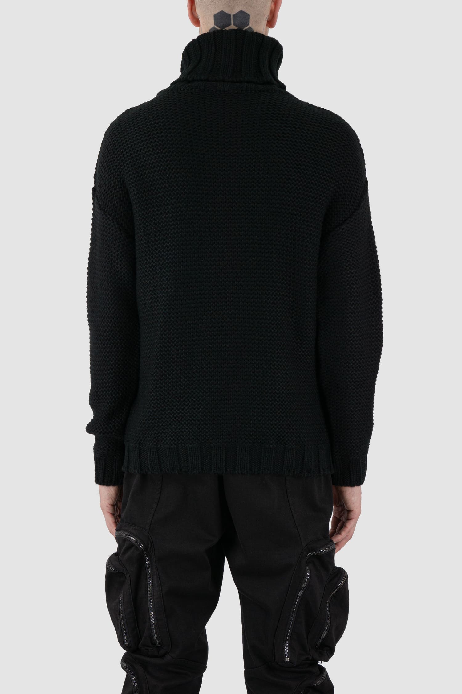 La Haine Inside Us - back view of black high neck waffle knit sweater for men from the FW24 collection with a solid, thicker neck, dropped shoulders and a straight fit.