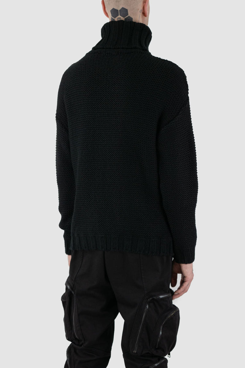 La Haine Inside Us - back side view of black high neck waffle knit sweater for men from the FW24 collection with a solid, thicker neck, dropped shoulders and a straight fit.