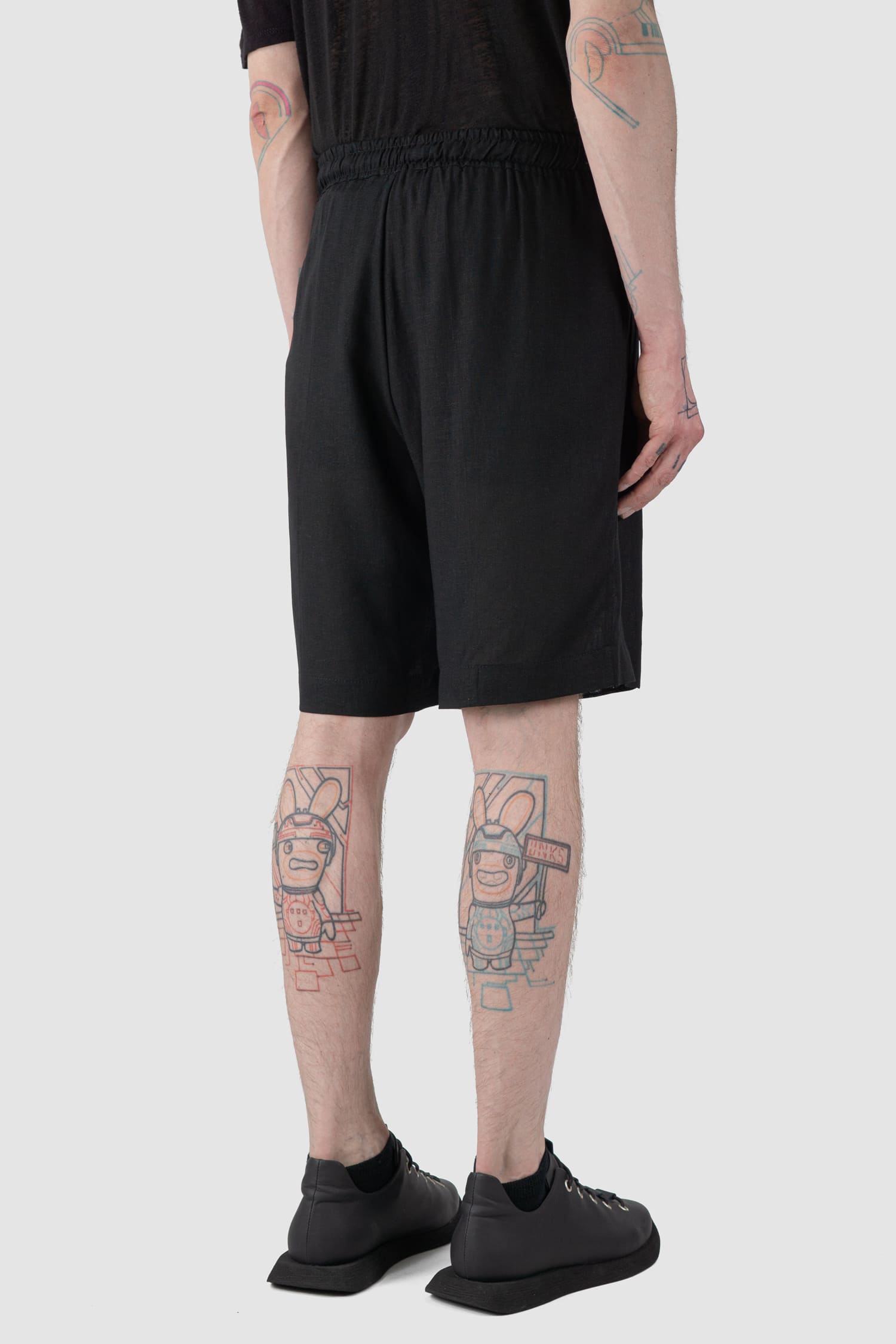 La Haine Inside Us - back side view of black Linen Blend Bermuda Shorts