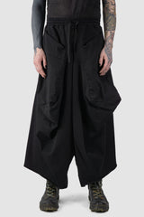 La Haine Inside us - front view of Black Oversized Draped Cropped Stretch Denim Trousers