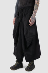 La Haine Inside us - front side view of Black Oversized Draped Cropped Stretch Denim Trousers