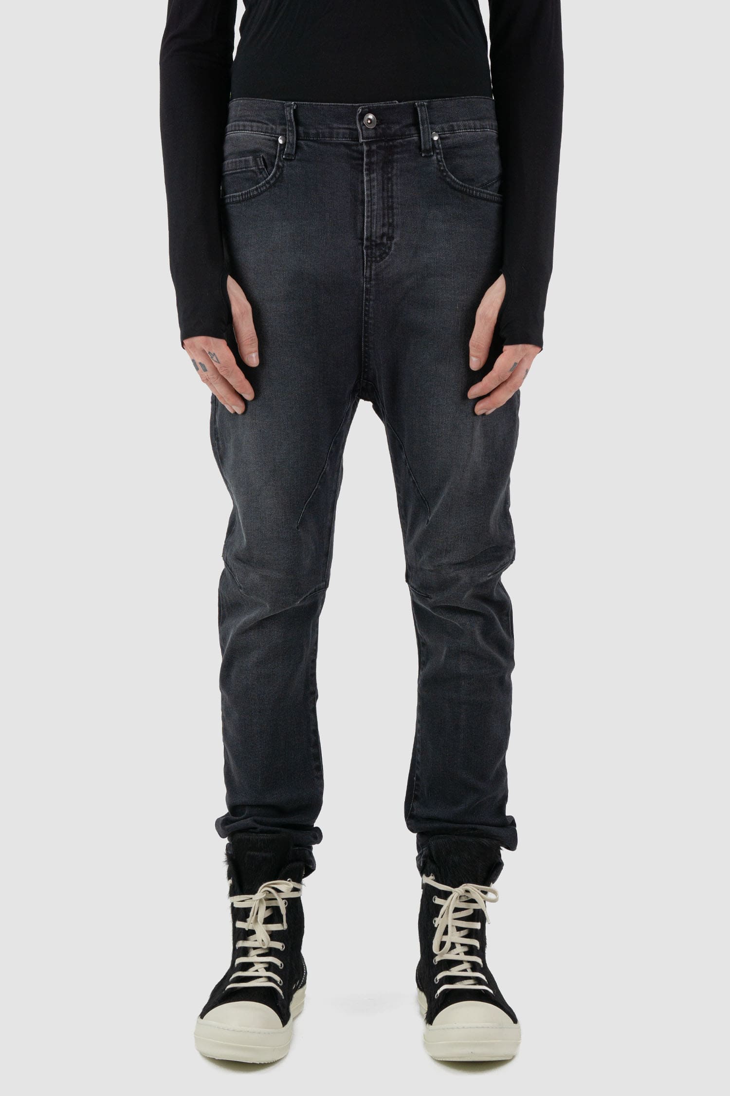 La Haine Inside Us - Front view of washed black men's slim fit stretch jeans with knee seam details, patch back pockets, FW24 collection.