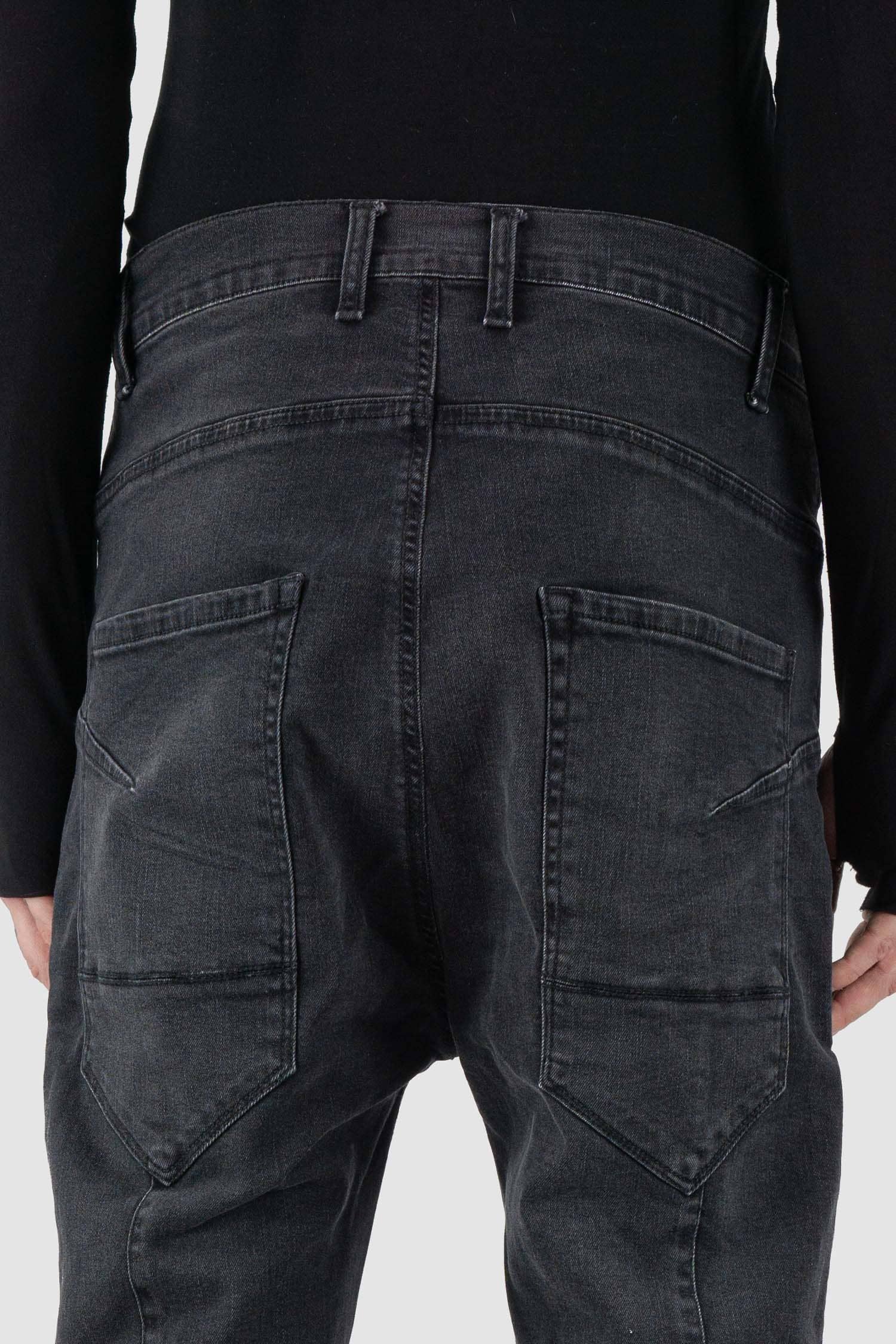La Haine Inside Us - back detail view of washed black men's slim fit stretch jeans with knee seam details, patch back pockets, FW24 collection.