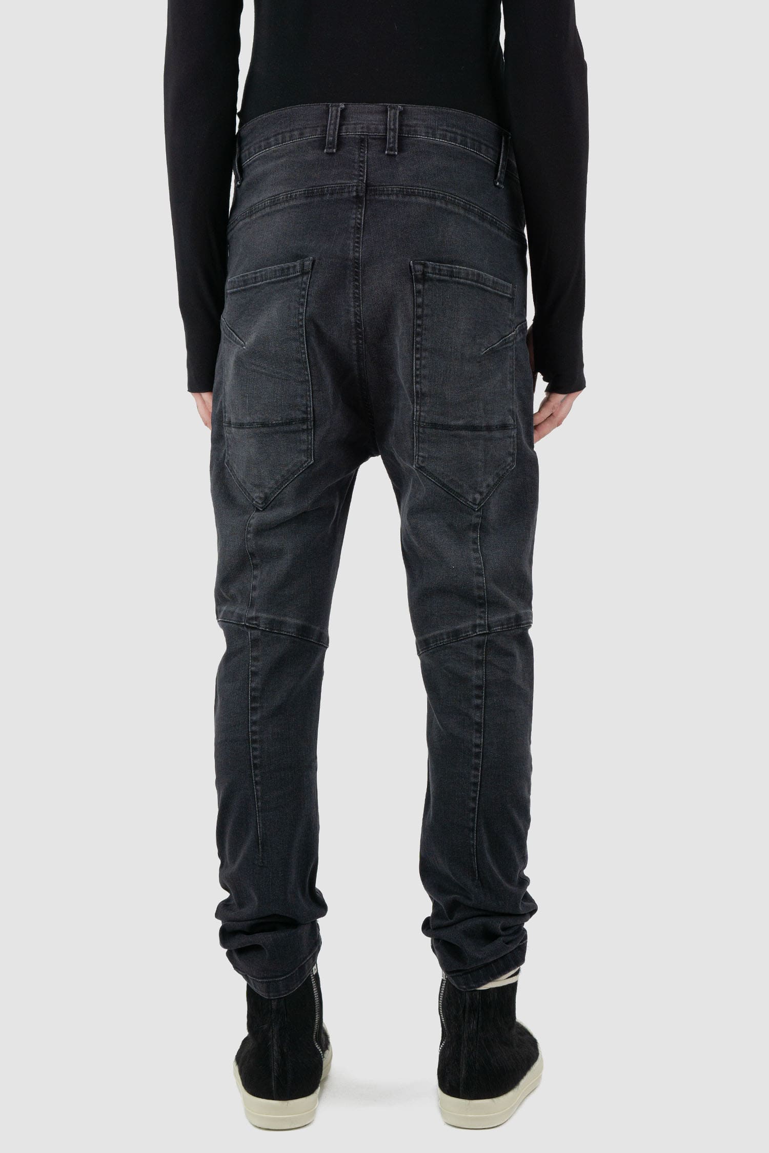 La Haine Inside Us - back view of washed black men's slim fit stretch jeans with knee seam details, patch back pockets, FW24 collection.