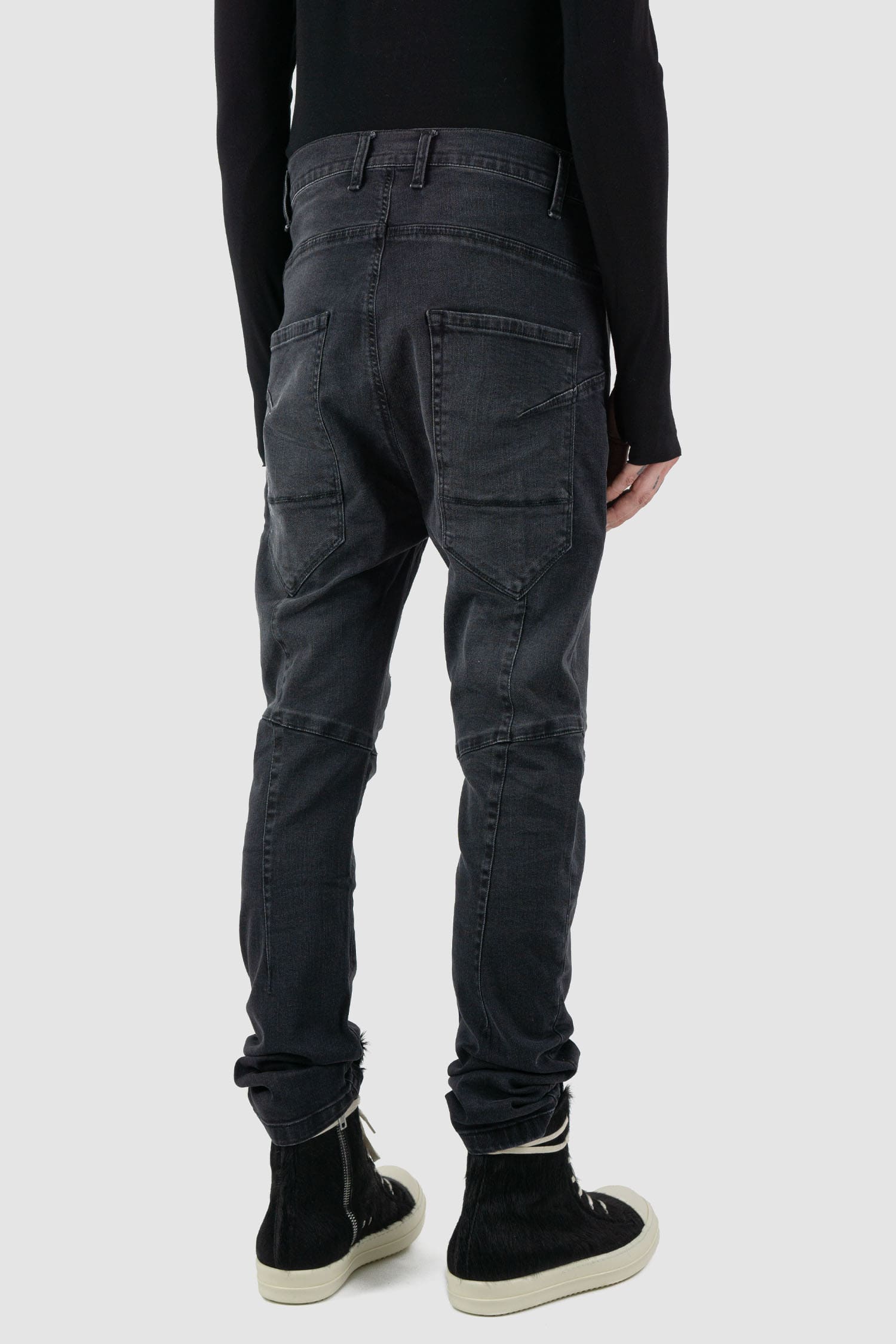 La Haine Inside Us - back side view of washed black men's slim fit stretch jeans with knee seam details, patch back pockets, FW24 collection.