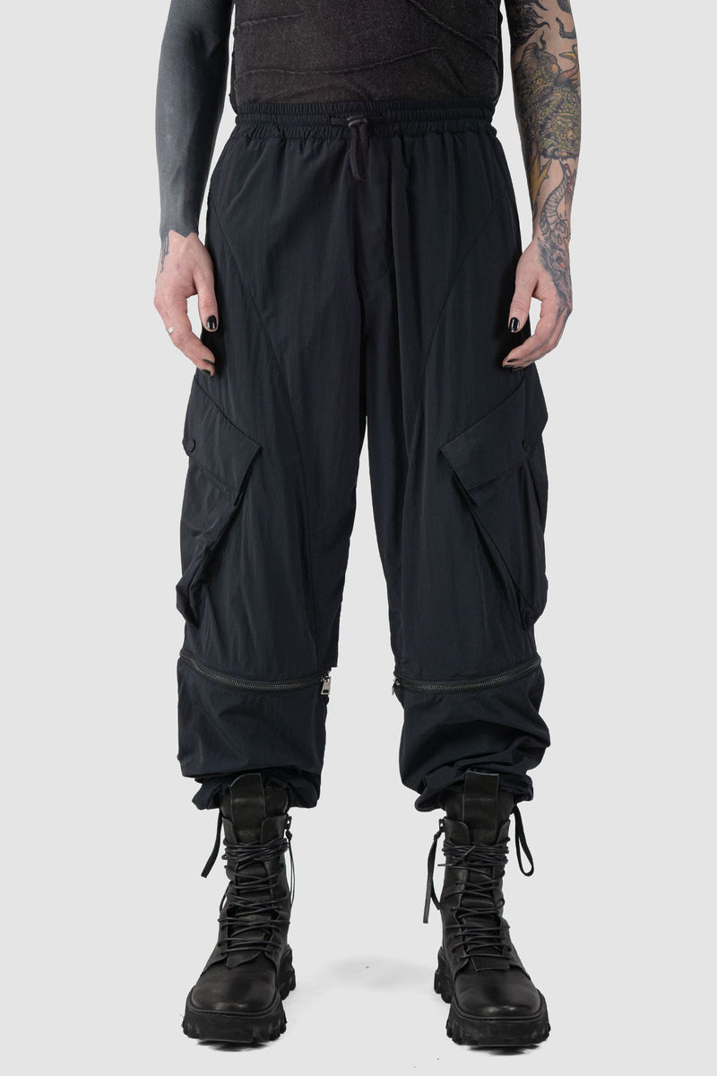 La Haine Inside us - front view of Black Utility Transform Cargo Pocket Trousers