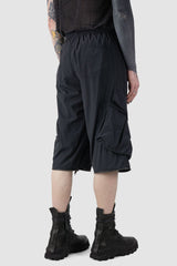 La Haine Inside us - back shorted view of Black Utility Transform Cargo Pocket Trousers