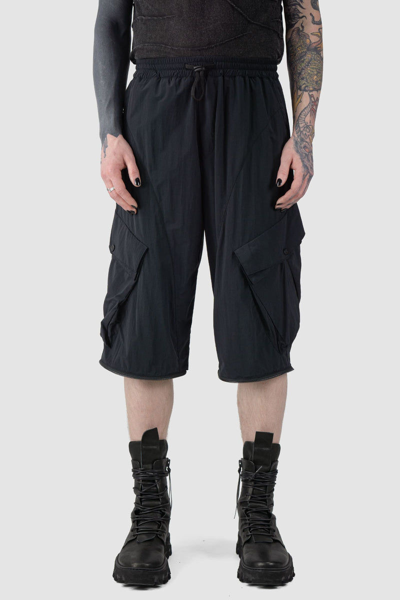 La Haine Inside us - front shorted view of Black Utility Transform Cargo Pocket Trousers