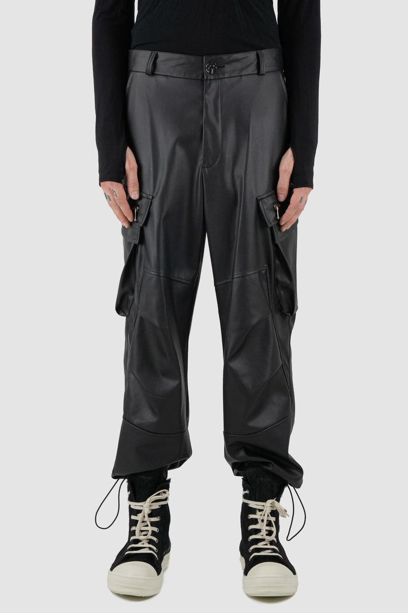 La Haine Inside Us - Front view of black men's vegan leather cargo pants with belt loops, adjustable drawstring at bottom hem, FW24 collection.