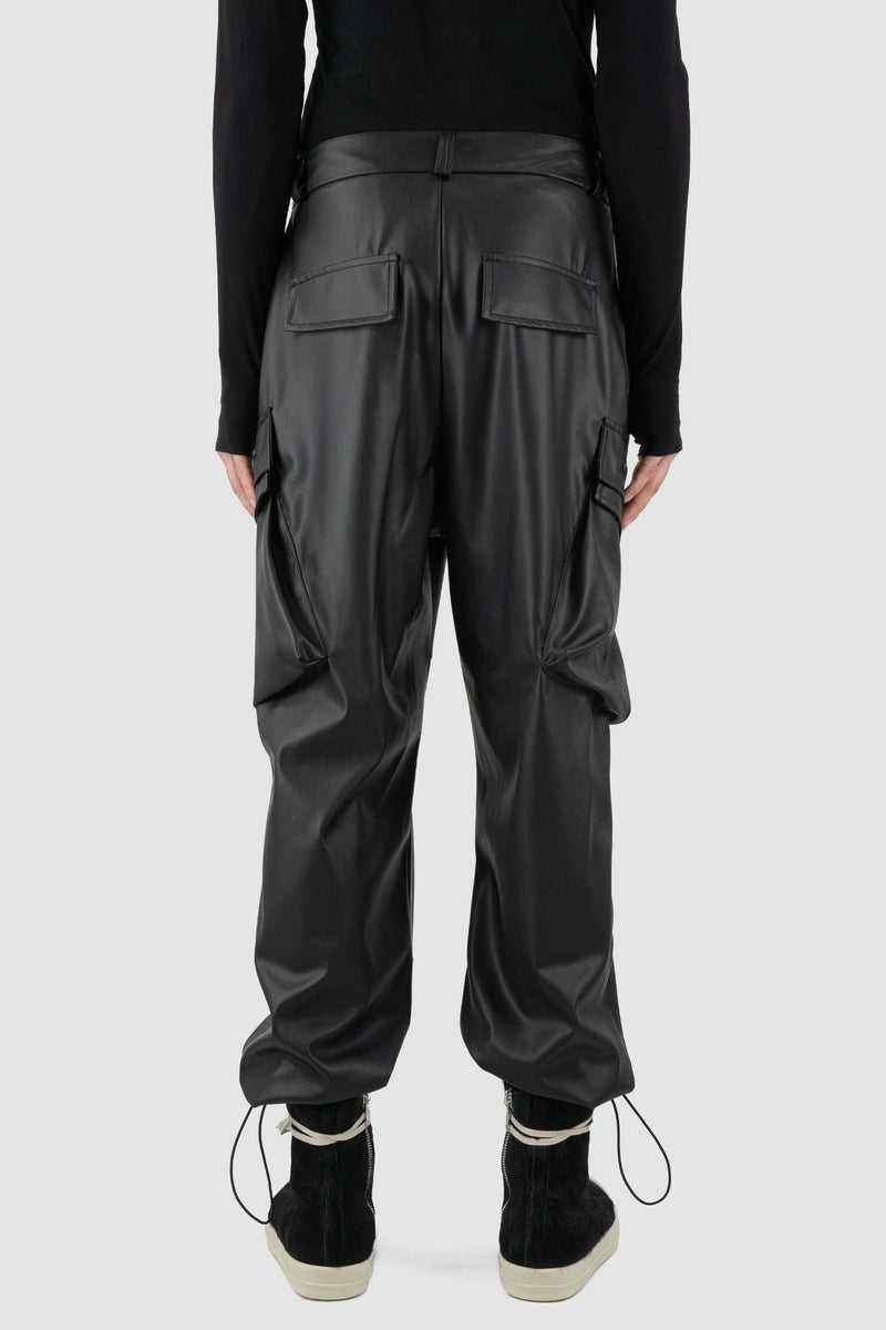 La Haine Inside Us - back view of black men's vegan leather cargo pants with belt loops, adjustable drawstring at bottom hem, FW24 collection.