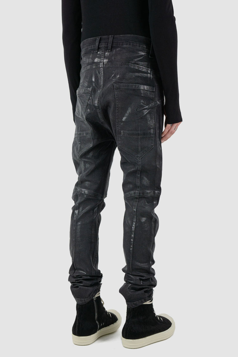 La Haine Inside Us - back side view of black men's coated slim fit jeans with stretch cotton denim, patch pockets, FW24 collection.