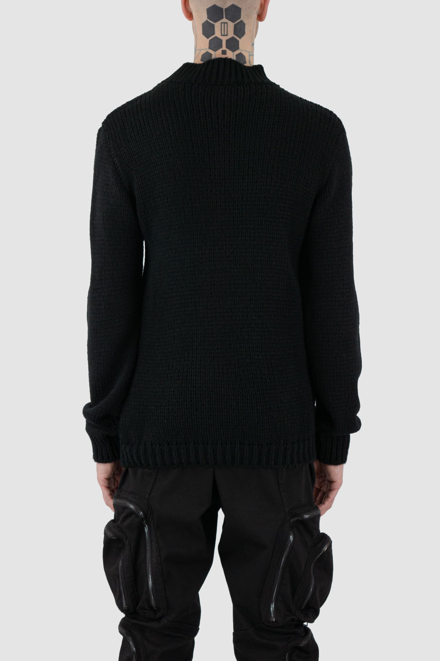 La Haine Inside Us - back view of black wool blend knit sweater for men from the FW24 collection with a thicker neck, hem- and cuffs and a straight fit.