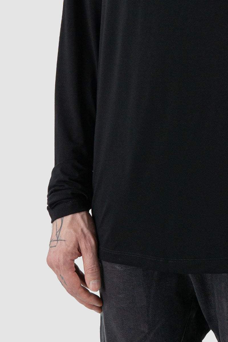 La Haine Inside Us - Front hem view of black men's turtleneck bamboo long sleeve with extra-long, relaxed arms, FW24 collection.