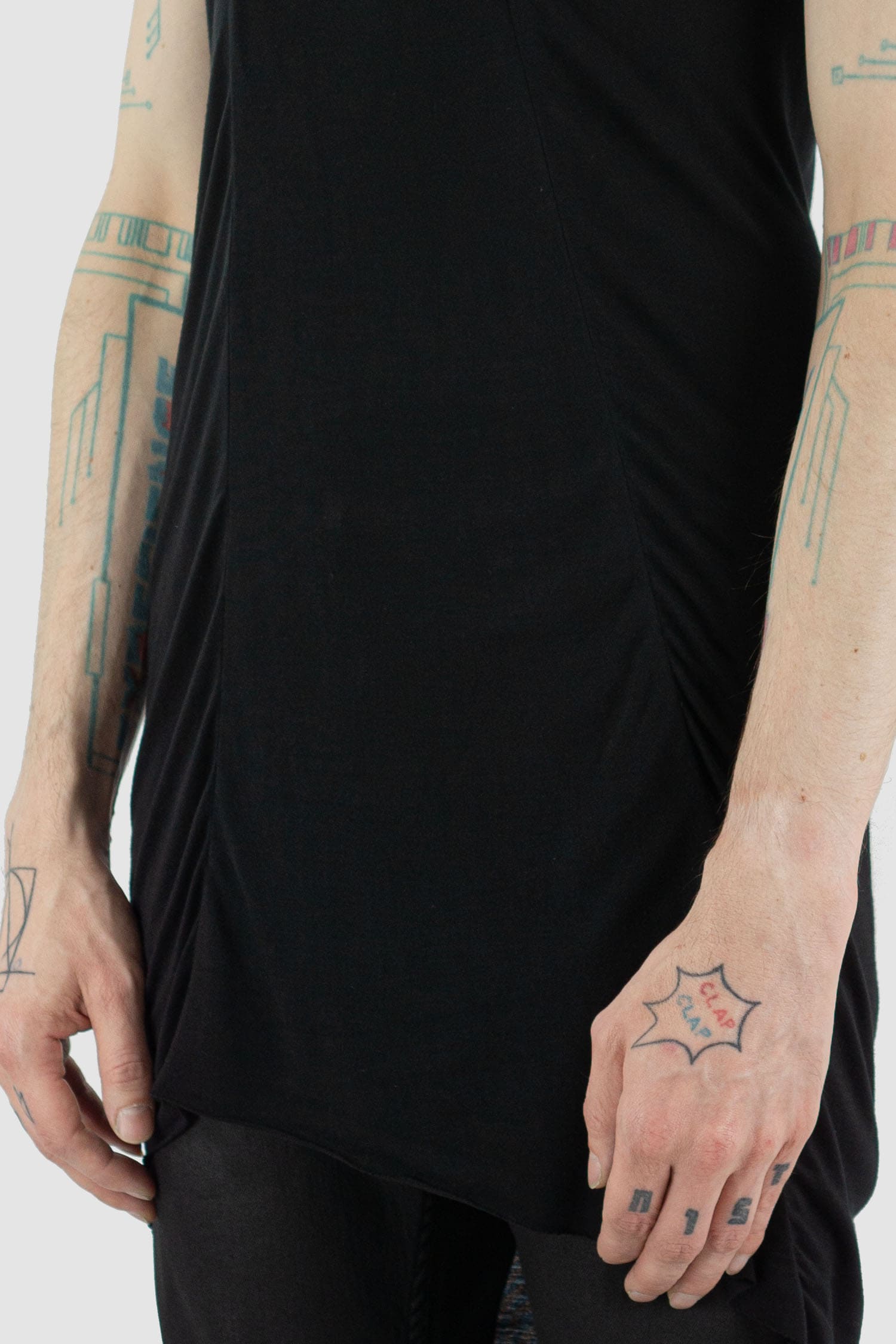 Leon Louis - hem view of black Amber muscle tank top with wide shoulders, loose fit, men's Permanent Collection.