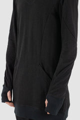 Leon Louis - side close up view of black cotton bulk hood sweater with thumbhole details, kangaroo pockets, men's Permanent Collection.