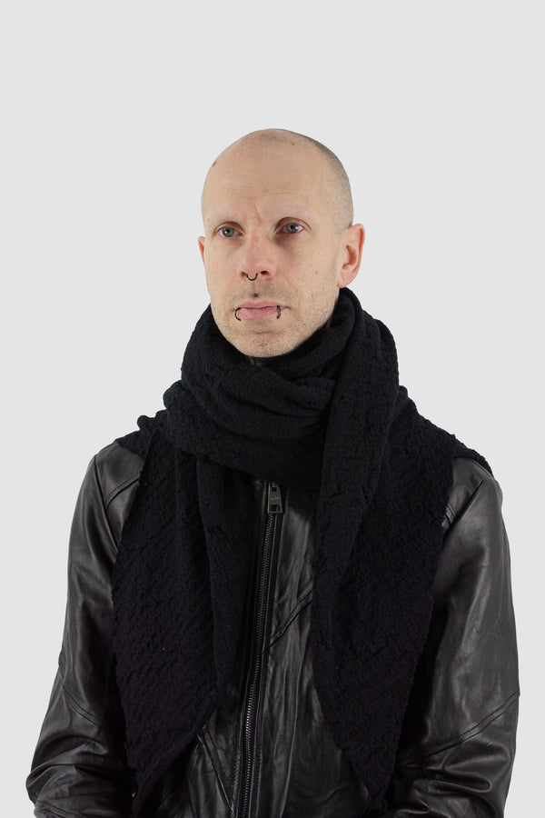 Leon Louis - model view of black merino wool rib scarf.