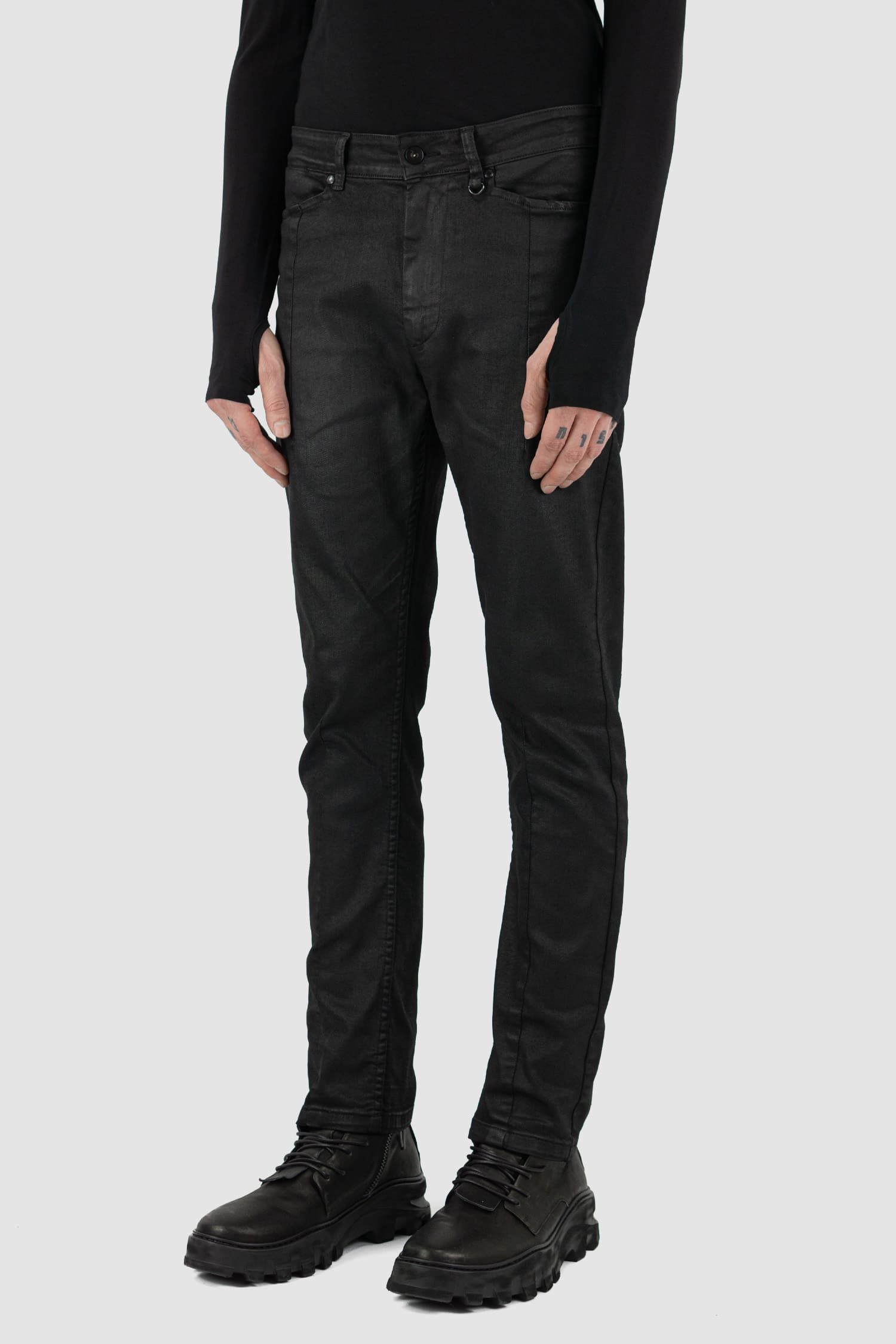 Leon Louis - side view of black waxed dart cut denim jeans.