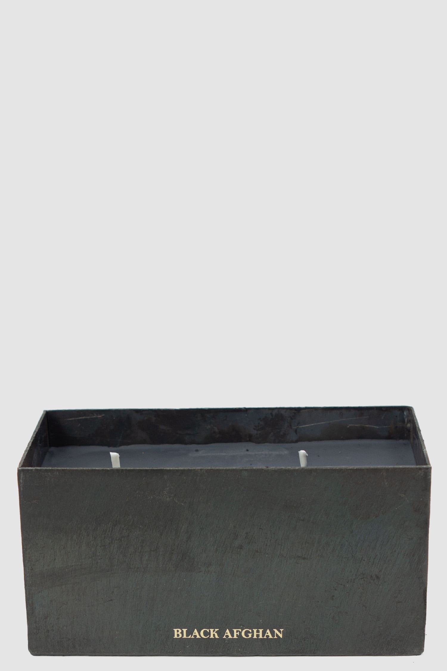 Mad et Len - open view of Black Afghan Scent Black Block Candle from the Permanent Collection with Burned Black Iron Vessel.