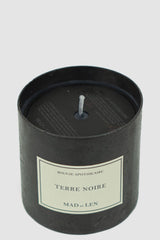 Mad et Len - front view of Terre Noire Bougie D'Apothicaire: Exquisite candle with Black Soy Wax in a Heavy Iron Vessel.