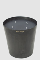 Mad et Len - front view of Black Afghan Scent Bougie Vestimentale Candle from the Permanent Collection with Burned Black Iron Vessel.