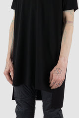 Nomen Nescio - hem detail view of black boxy T-shirt with round neckline, raglan shoulders, for men.