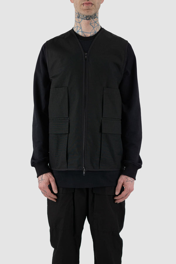 Nomen Nescio - Front view of black cotton field vest with multiple pockets, zip fastening, loose fit.