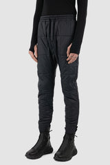 Nomen Nescio - Front view of black quilted slim pants.