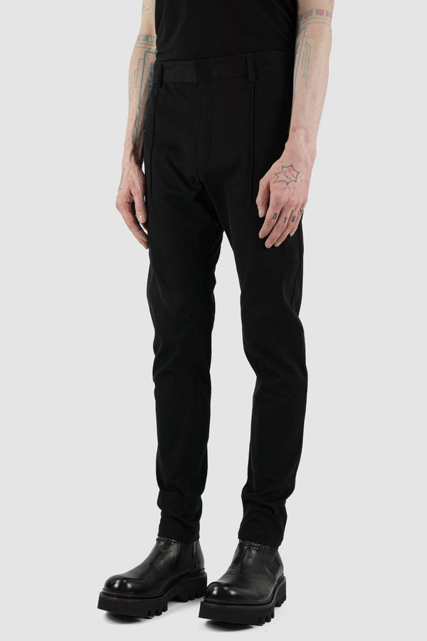 Nomen Nescio - side view of black cotton blend slim trousers.