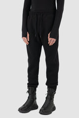 Nomen Nescio - side view of black woolen sweatpants.