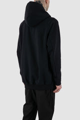 Nomen Nescio - back side view of black raglan zip hoodie with wool rib cuffs, relaxed fit.