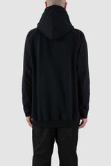 Nomen Nescio - back view of black raglan zip hoodie with wool rib cuffs, relaxed fit.